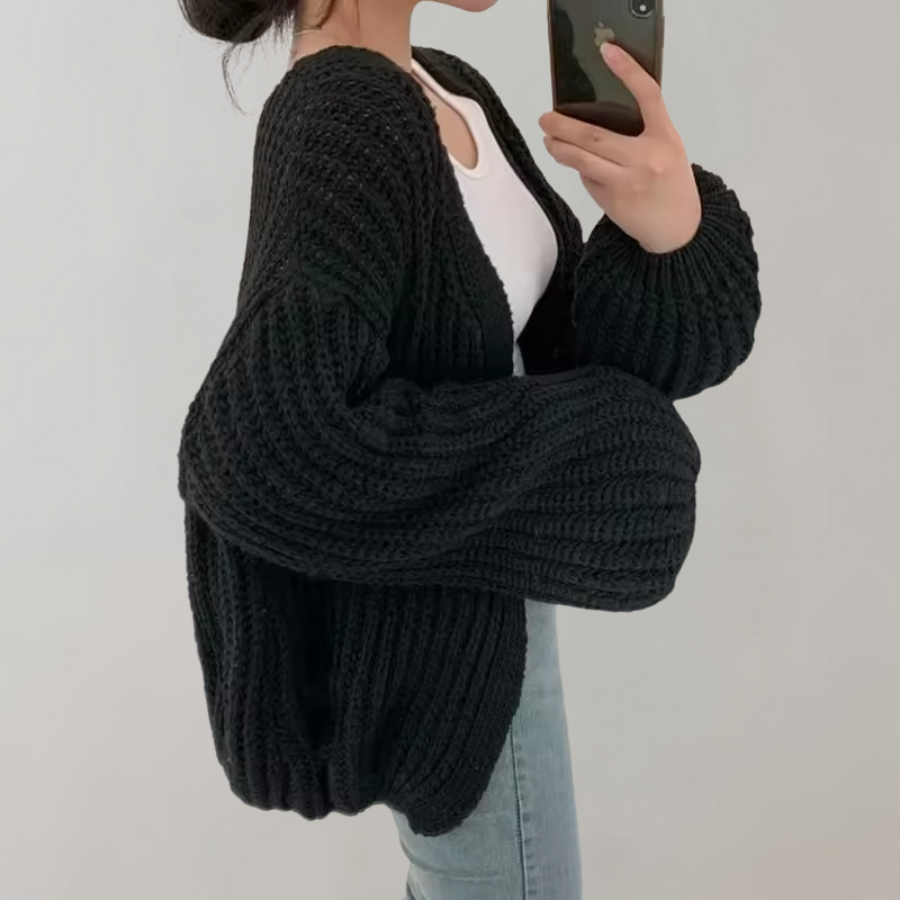 Women's chunky knit cardigan with an open front and oversized long sleeves