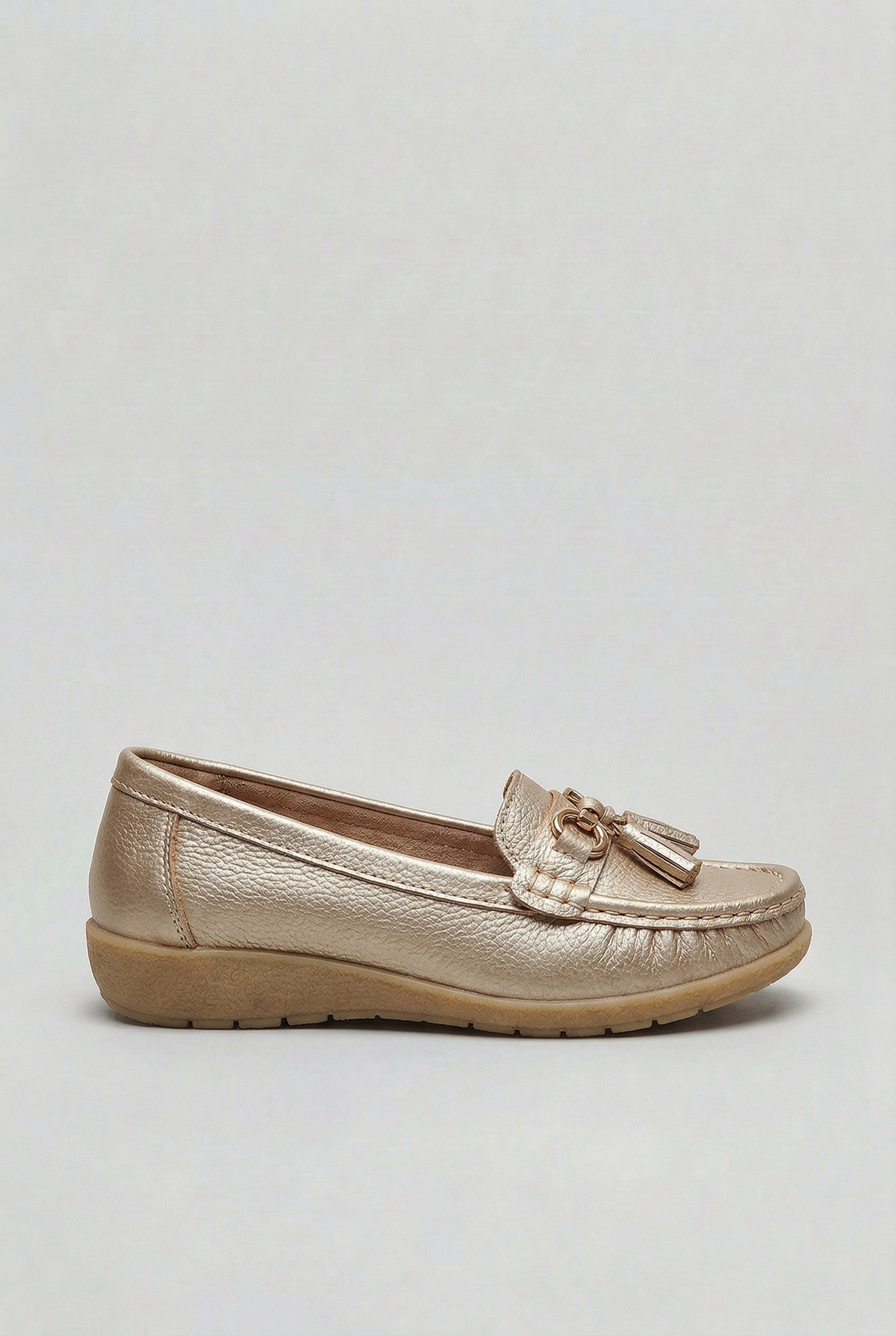 Women's slip-on tassel loafer with metal bit detail and low wedge sole