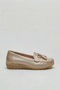 Women's slip-on tassel loafer with metal bit detail and low wedge sole