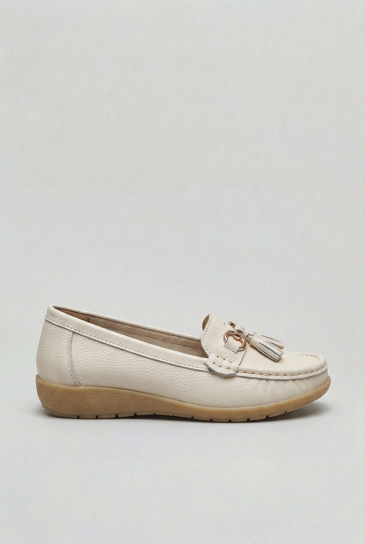 Women's slip-on tassel loafer with metal bit detail and low wedge sole