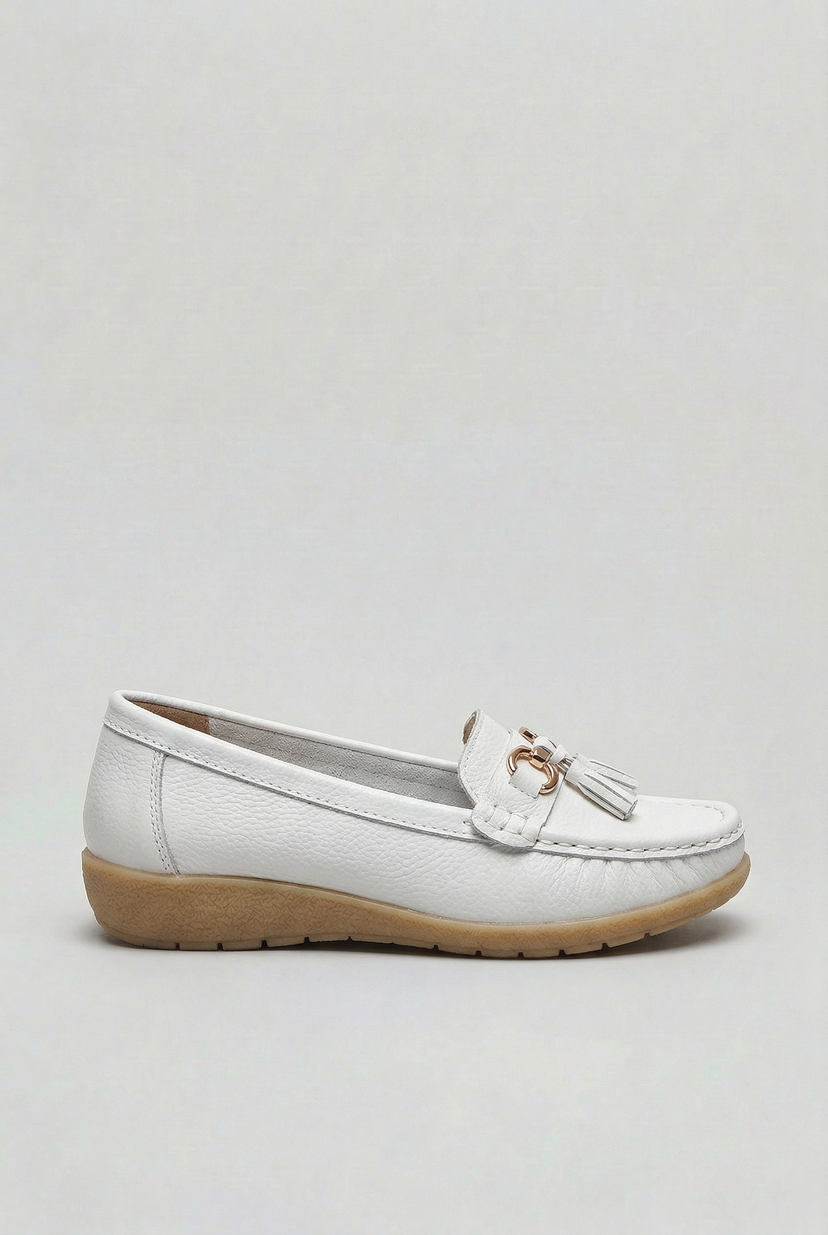 Women's slip-on tassel loafer with metal bit detail and low wedge sole