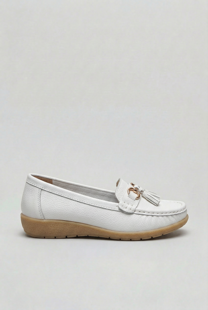 Women's slip-on tassel loafer with metal bit detail and low wedge sole