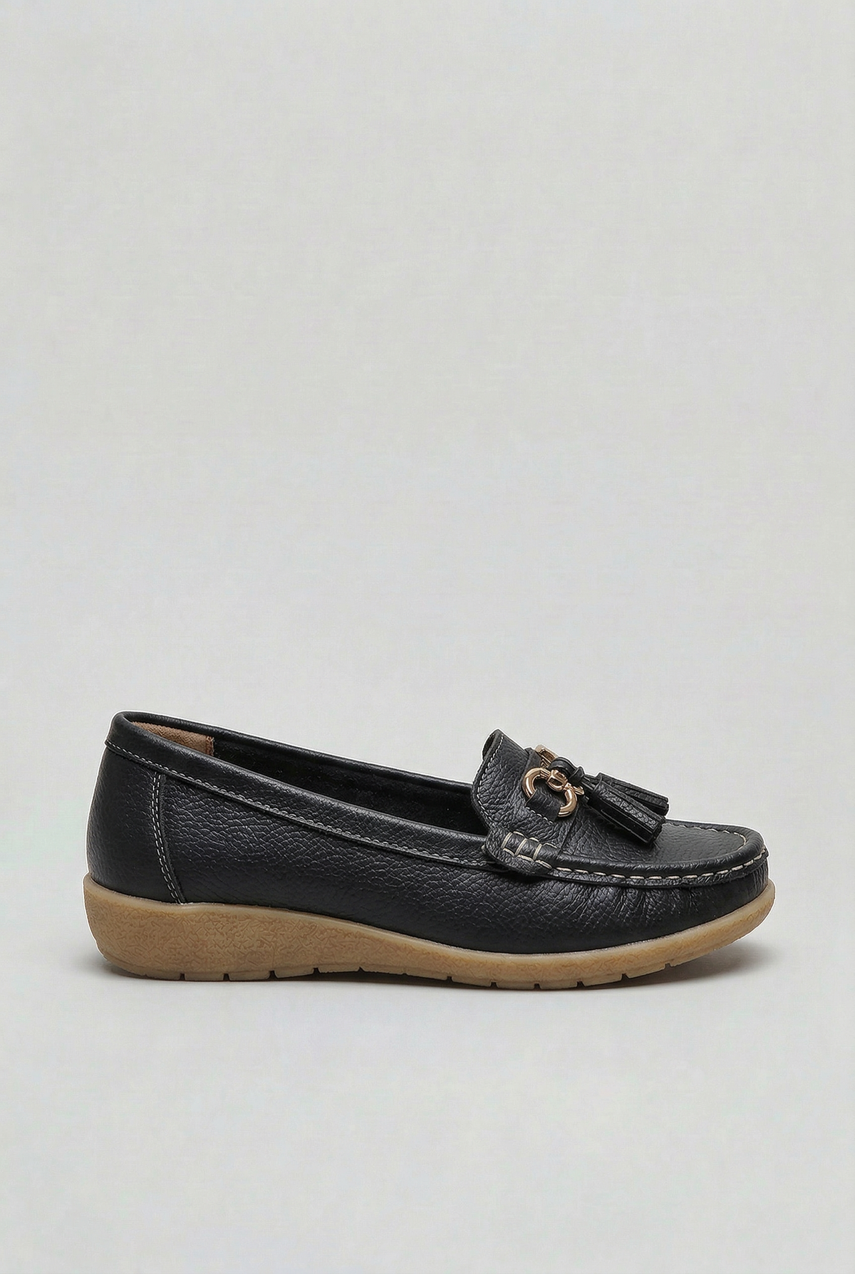 Women's slip-on tassel loafer with metal bit detail and low wedge sole