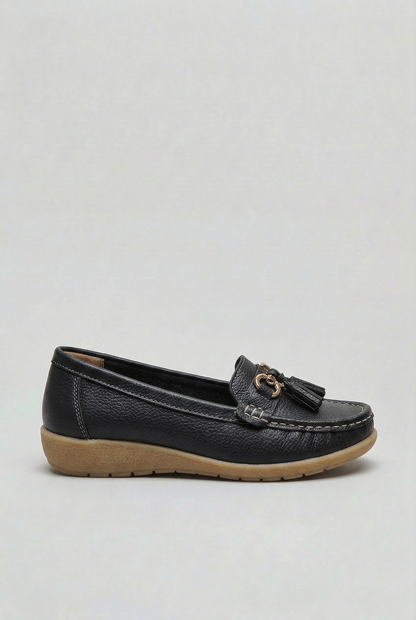 Women's slip-on tassel loafer with metal bit detail and low wedge sole