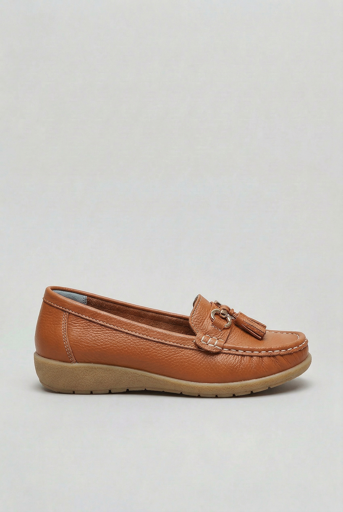 Women's slip-on tassel loafer with metal bit detail and low wedge sole