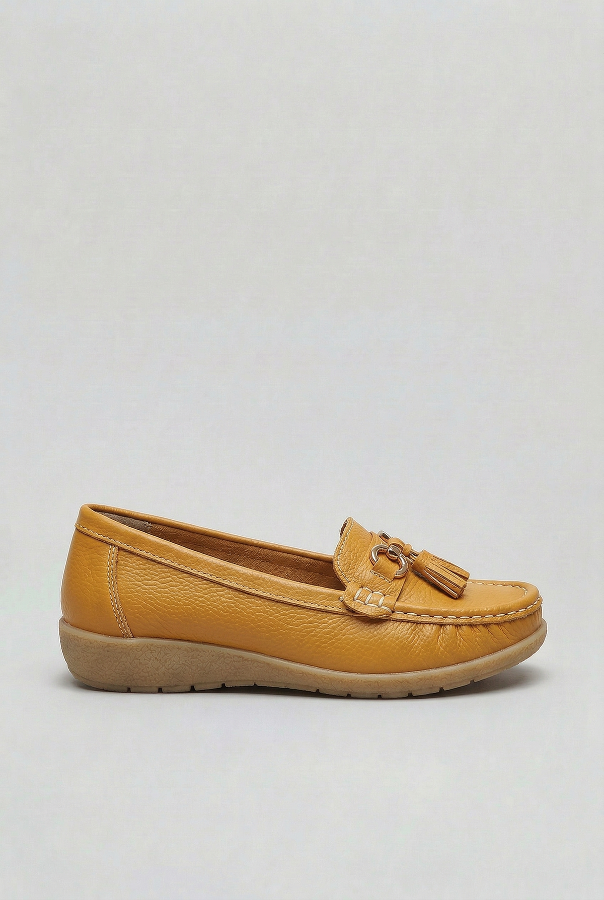 Women's slip-on tassel loafer with metal bit detail and low wedge sole