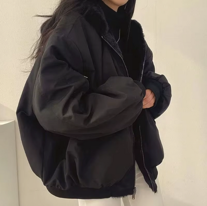Women's lined bomber-style winter jacket with plush collar and zip front