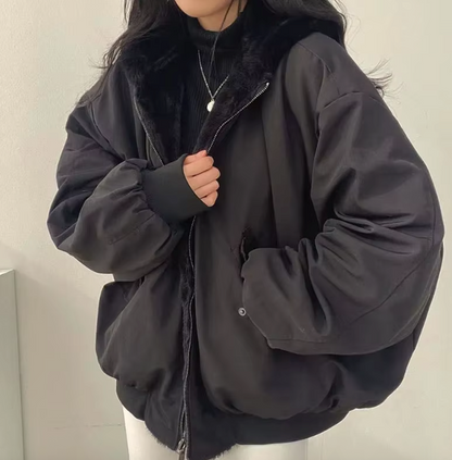 Women's lined bomber-style winter jacket with plush collar and zip front