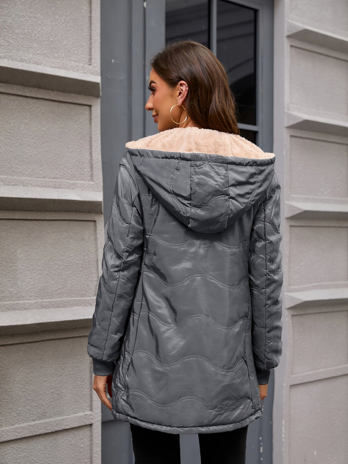 Women's long hooded quilted jacket with fleece-look lining and zip front