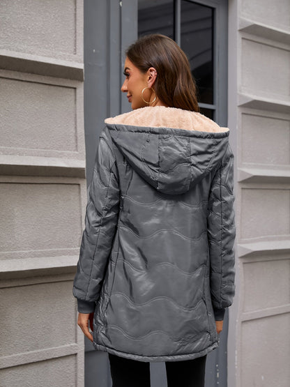 Women's long hooded quilted jacket with fleece-look lining and zip front