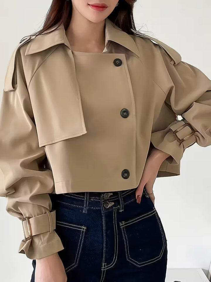 Women's beige cropped double-breasted trench coat with buckle cuffs