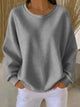 Women's textured crew neck sweater with long sleeves and ribbed trims
