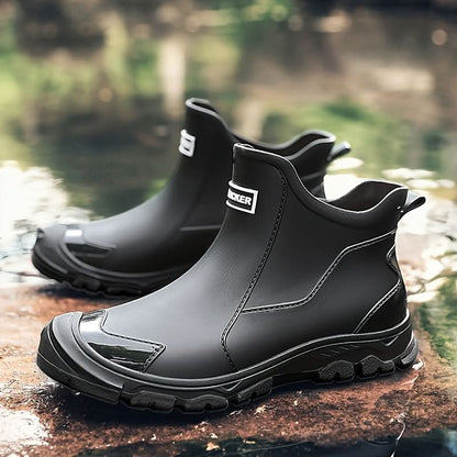 Ankle boots with pull tabs, stitched panels and lug soles