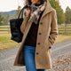 Women's textured mid-length button coat with lapel collar and side pockets