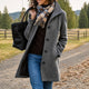 Women's textured mid-length button coat with lapel collar and side pockets