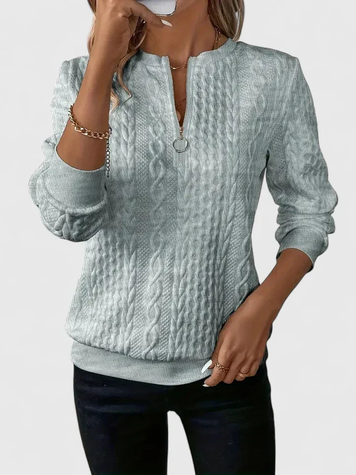 Women's textured cable knit sweater with zip neckline and ribbed trims