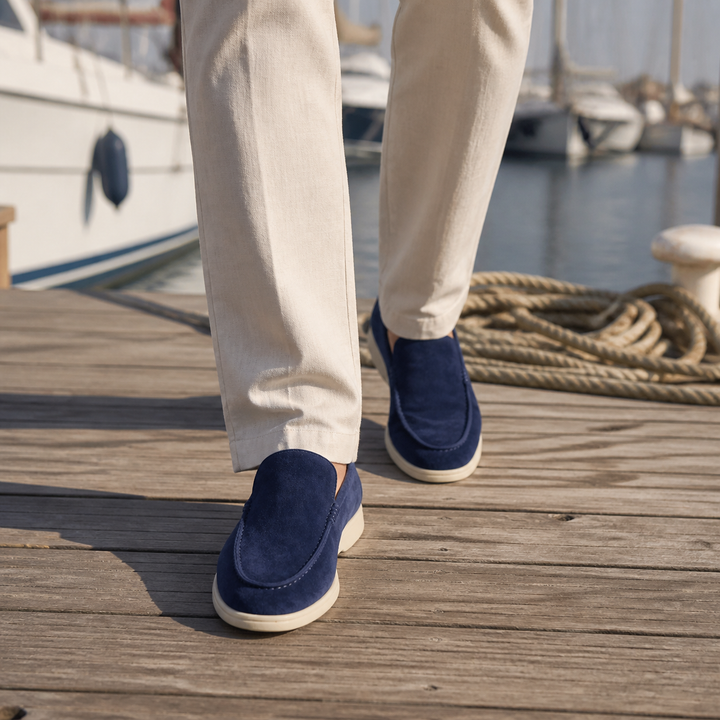 Men's rounded-toe slip-on loafers with moc-toe stitching and contrasting soles