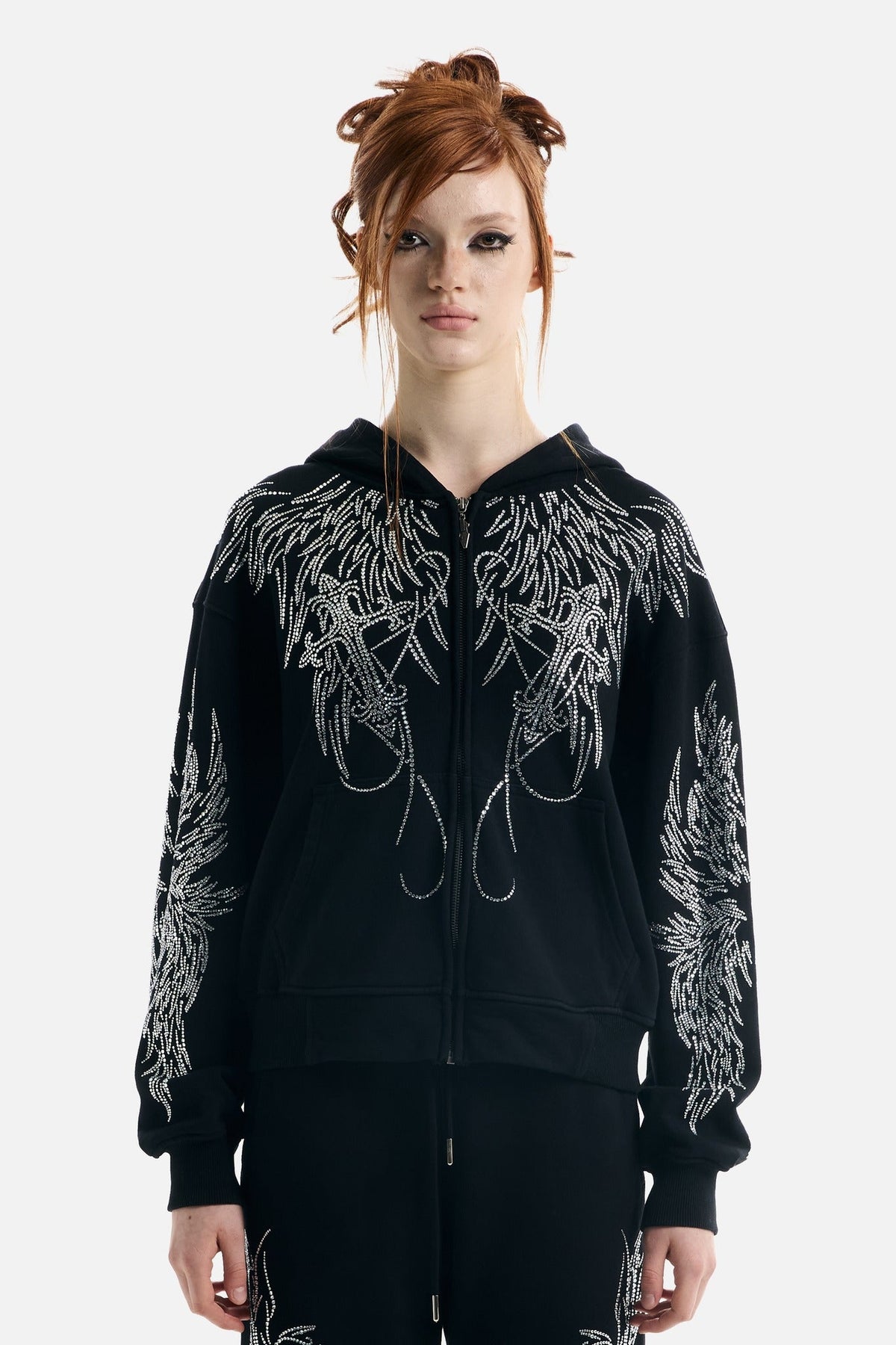 Women's black zip-up hoodie with silver rhinestone wing designs