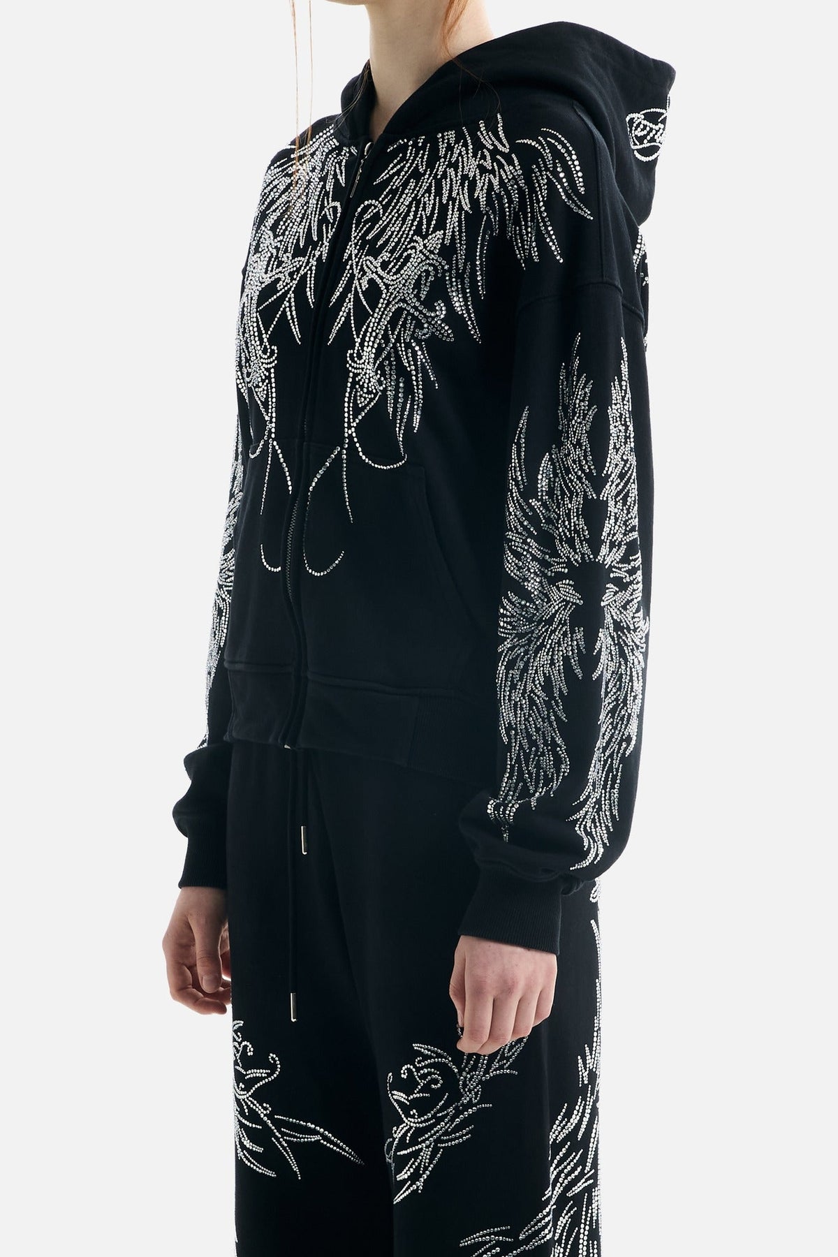 Women's black zip-up hoodie with silver rhinestone wing designs