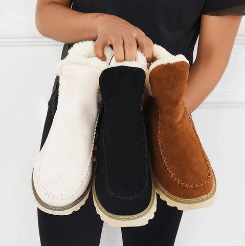 Women's short lined slip-on ankle boots with round toes, contrast trim and ridged platform soles