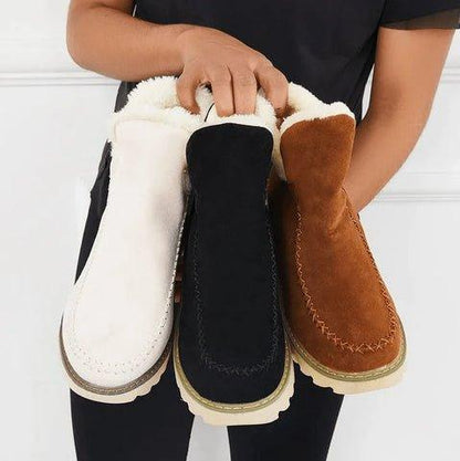 Women's short lined slip-on ankle boots with round toes, contrast trim and ridged platform soles