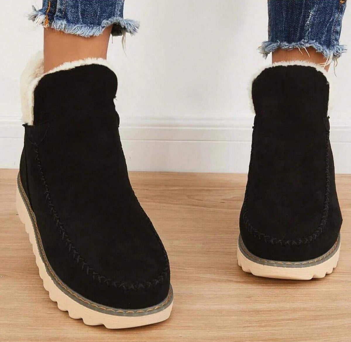 Women's short lined slip-on ankle boots with round toes, contrast trim and ridged platform soles