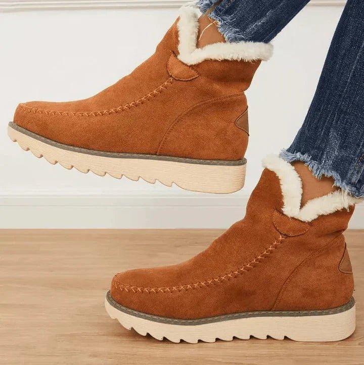 Women's short lined slip-on ankle boots with round toes, contrast trim and ridged platform soles