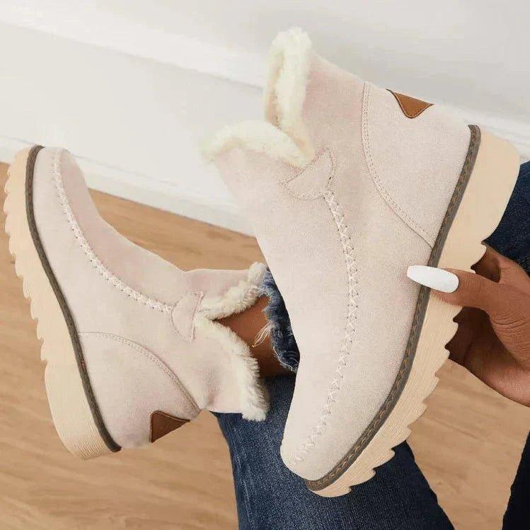 Women's short lined slip-on ankle boots with round toes, contrast trim and ridged platform soles