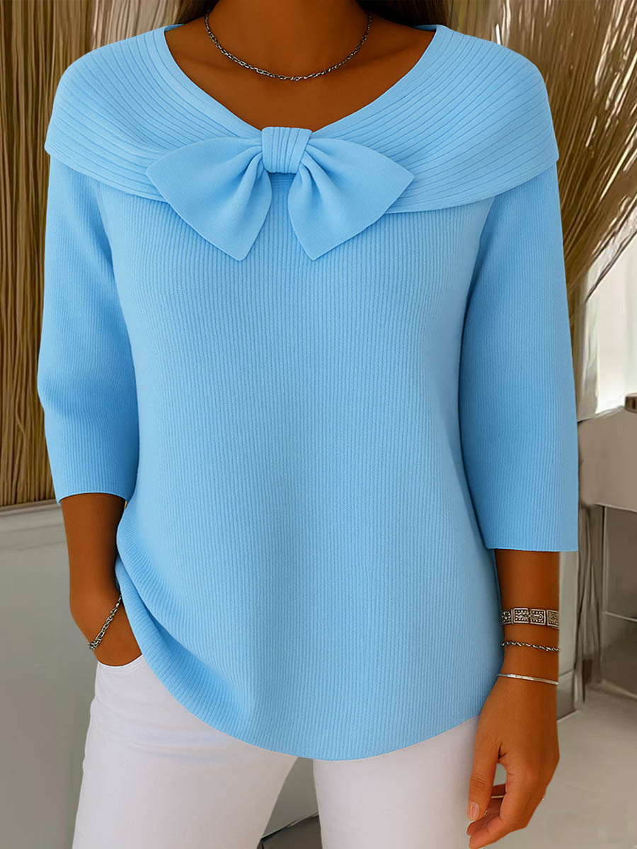 Women's ribbed sweater top with boat neckline and front bow