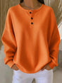Women's long-sleeve waffle knit henley top with button placket