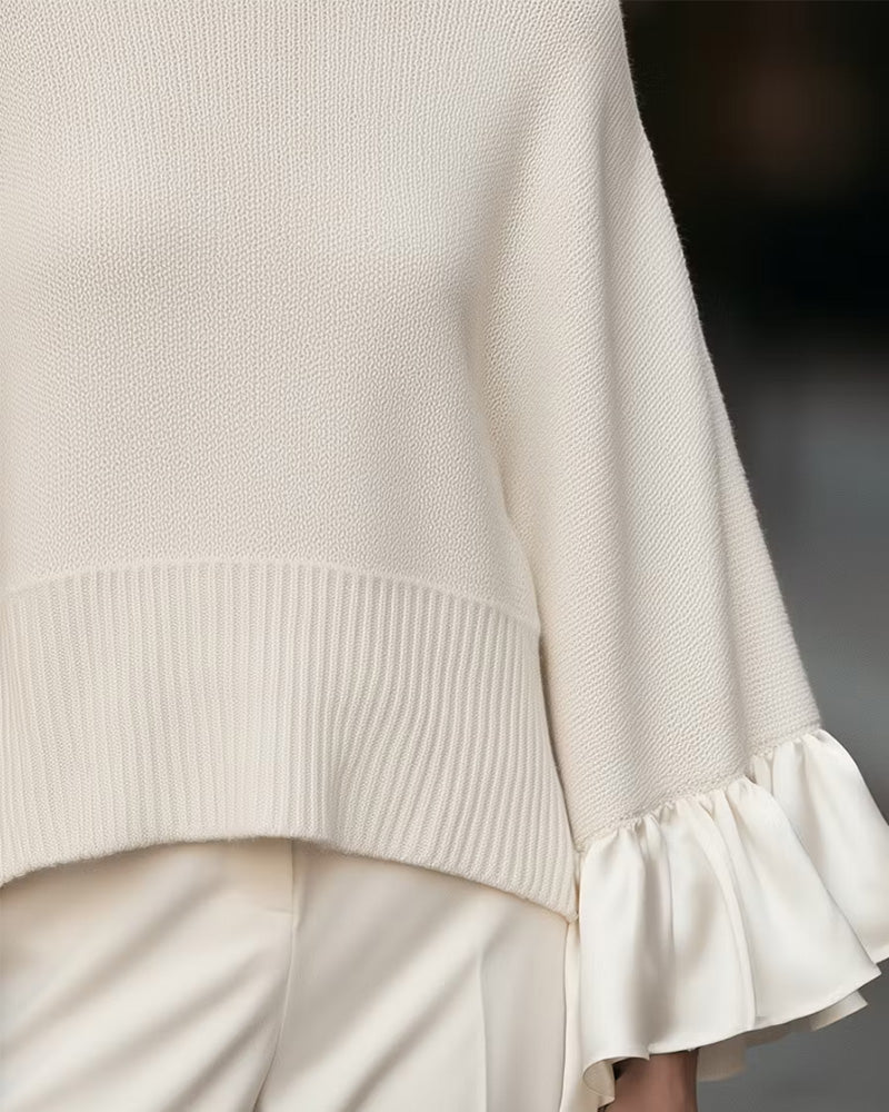 Women's cream turtleneck sweater with long ruffle sleeves and ribbed hem