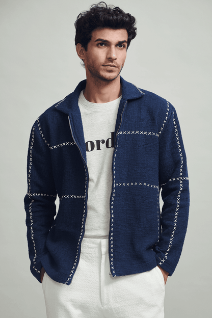 Men's navy zip jacket with stand collar and contrasting cross-stitch detailing
