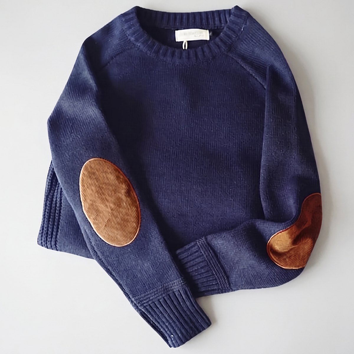 Textured crew neck knit sweater with contrasting elbow patches