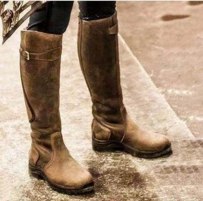 Women's tall riding boots with buckle straps, rounded toes and low heels