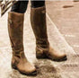 Women's tall riding boots with buckle straps, rounded toes and low heels