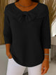 Women's ribbed sweater top with boat neckline and front bow