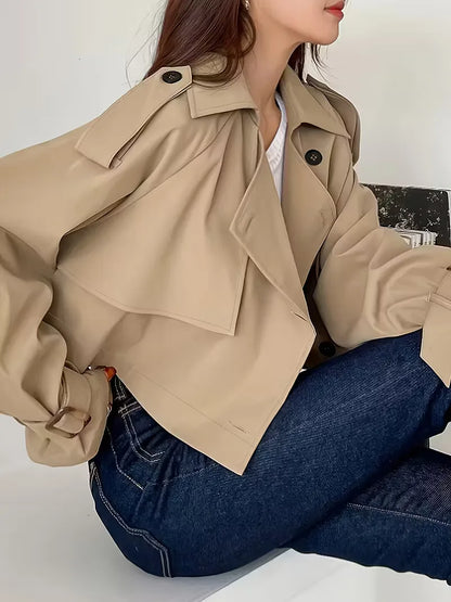 Women's beige cropped double-breasted trench coat with buckle cuffs