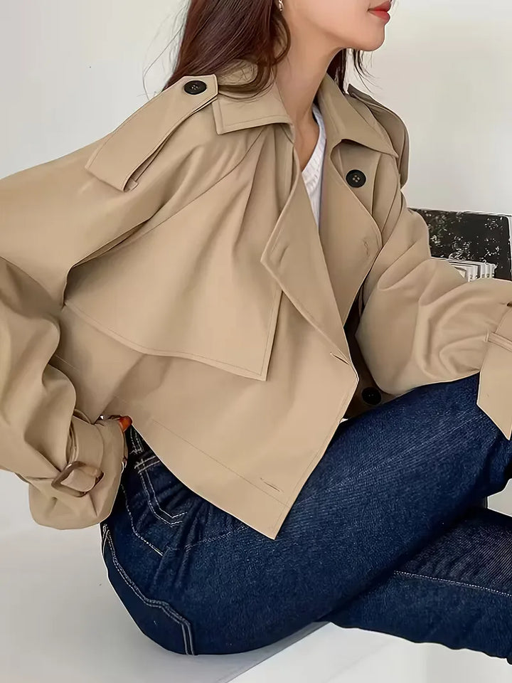 Women's beige cropped double-breasted trench coat with buckle cuffs