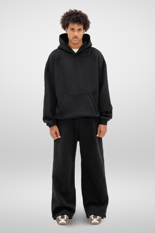 Men's black wide-leg sweatpants with elastic waistband and side pockets