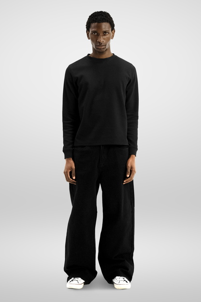 Men's black long sleeve crew neck top with textured finish
