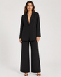Women's brown single-breasted blazer with matching wide-leg trousers, notch lapel and patch pockets