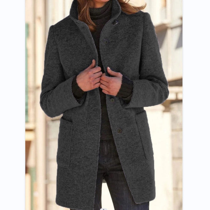 Women's straight mid-thigh coat with stand collar, long sleeves, buttons and patch pockets