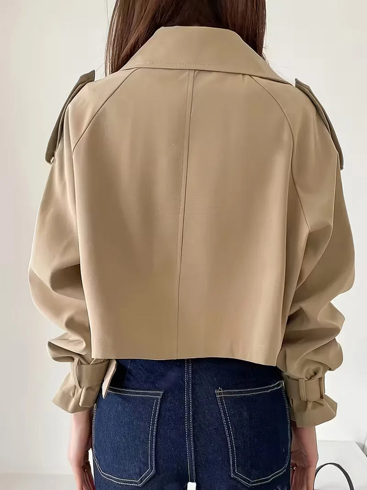 Women's beige cropped double-breasted trench coat with buckle cuffs