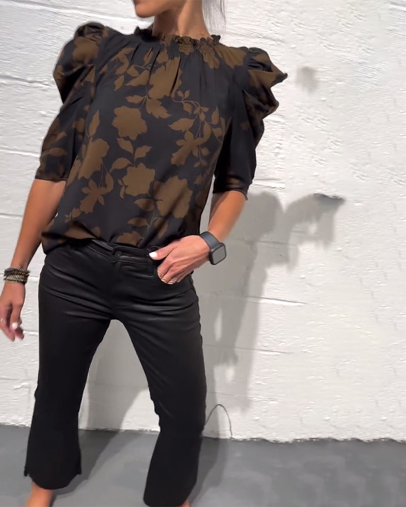 Women's floral blouse with ruched round neckline and 3/4 puff sleeves