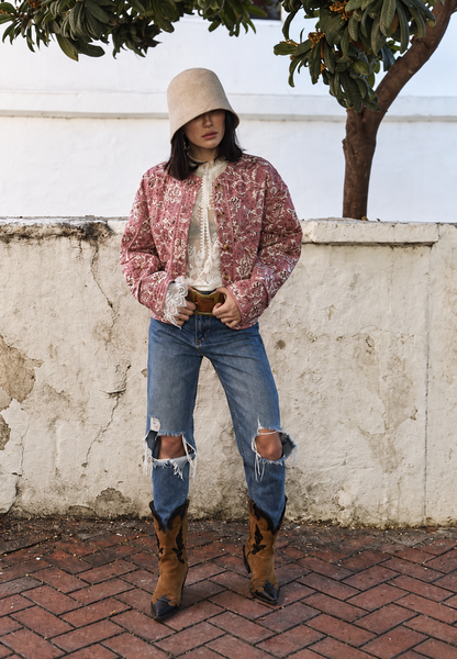Women's pink floral quilted jacket with button front and piped trims