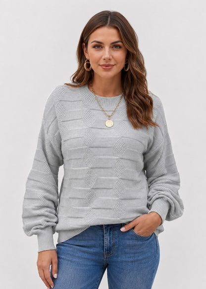 Women's textured crew neck sweater with long sleeves and geometric knit details