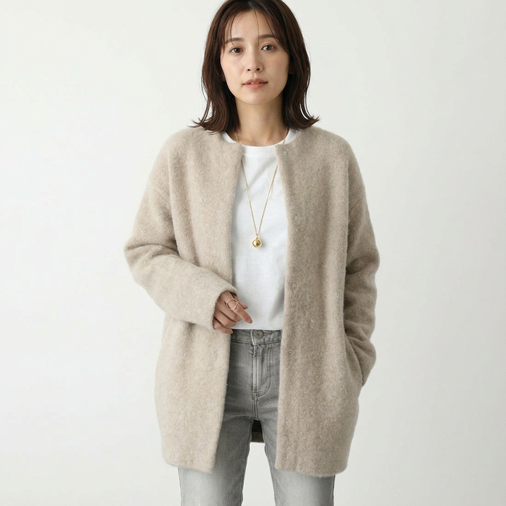 Women's long textured button front cardigan with patch pockets