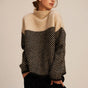 Women's cowl neck sweater with cream and black chevron pattern blocking, long sleeves with ribbed cuffs