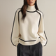 Women's turtleneck knit sweater with long sleeves and contrast piping