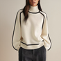 Women's turtleneck knit sweater with long sleeves and contrast piping